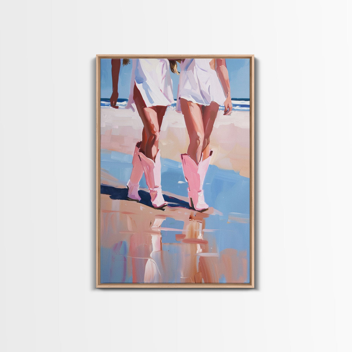 Cowgirls walking on the beach wearing pink cowboy boots, artistic reflection Framed Canvas Print - beach fashion, summer decor, vibrant art