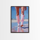 Woman wearing pink cowboy boots standing on the beach, vibrant pop art style Framed Canvas Print - beach fashion, coastal decor, summer art