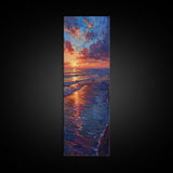 Framed Canvas Print of a Colorful Skinny Art Sunset Over the Ocean with a Vibrant Sky Reflecting on the Water in this Tall Coastal Landscape Art